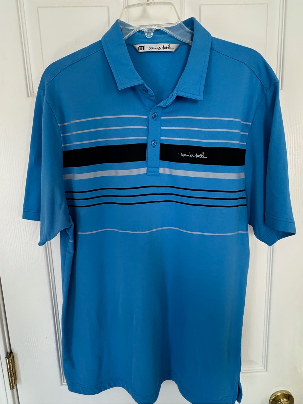 Travis Mathew Blue Polo with Black and Light Blue Stripes